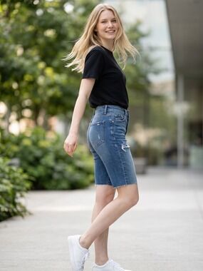 24. Sneak Peek High Rise Distressed Denim Shorts